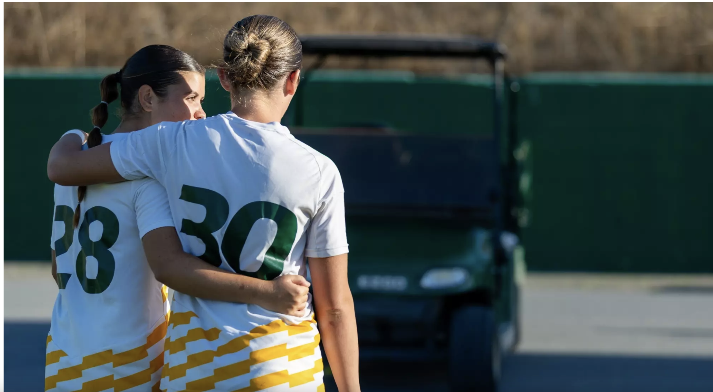Madison Hall and Bella Barrett celebrating their PacWest awards of making First Team All PacWest